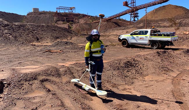 Electromagnetic geophysical survey equipment in use at a mining site